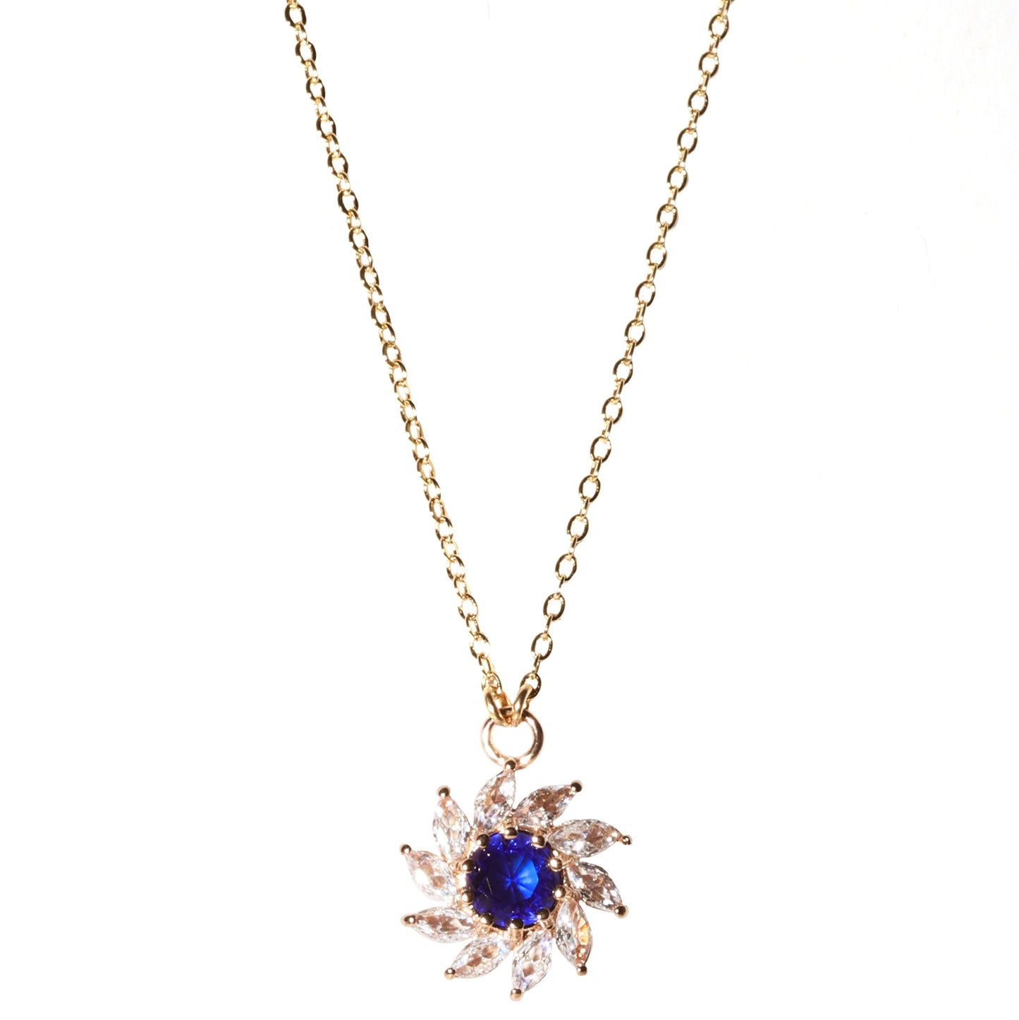 Gold necklace with a blue gemstone pendant on a white background