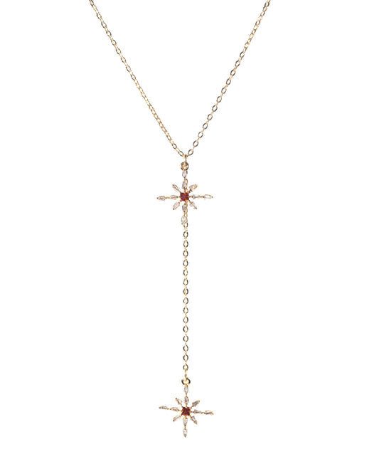 Gold necklace with star-shaped pendants on a white background