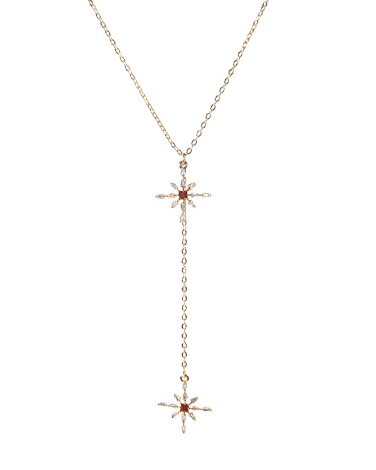 Gold necklace with star-shaped pendants on a white background