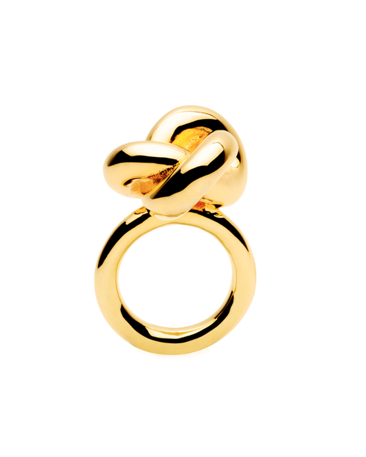 Close-up gold knotted Ophira Ring by Studio Baloge, shot against a white background.