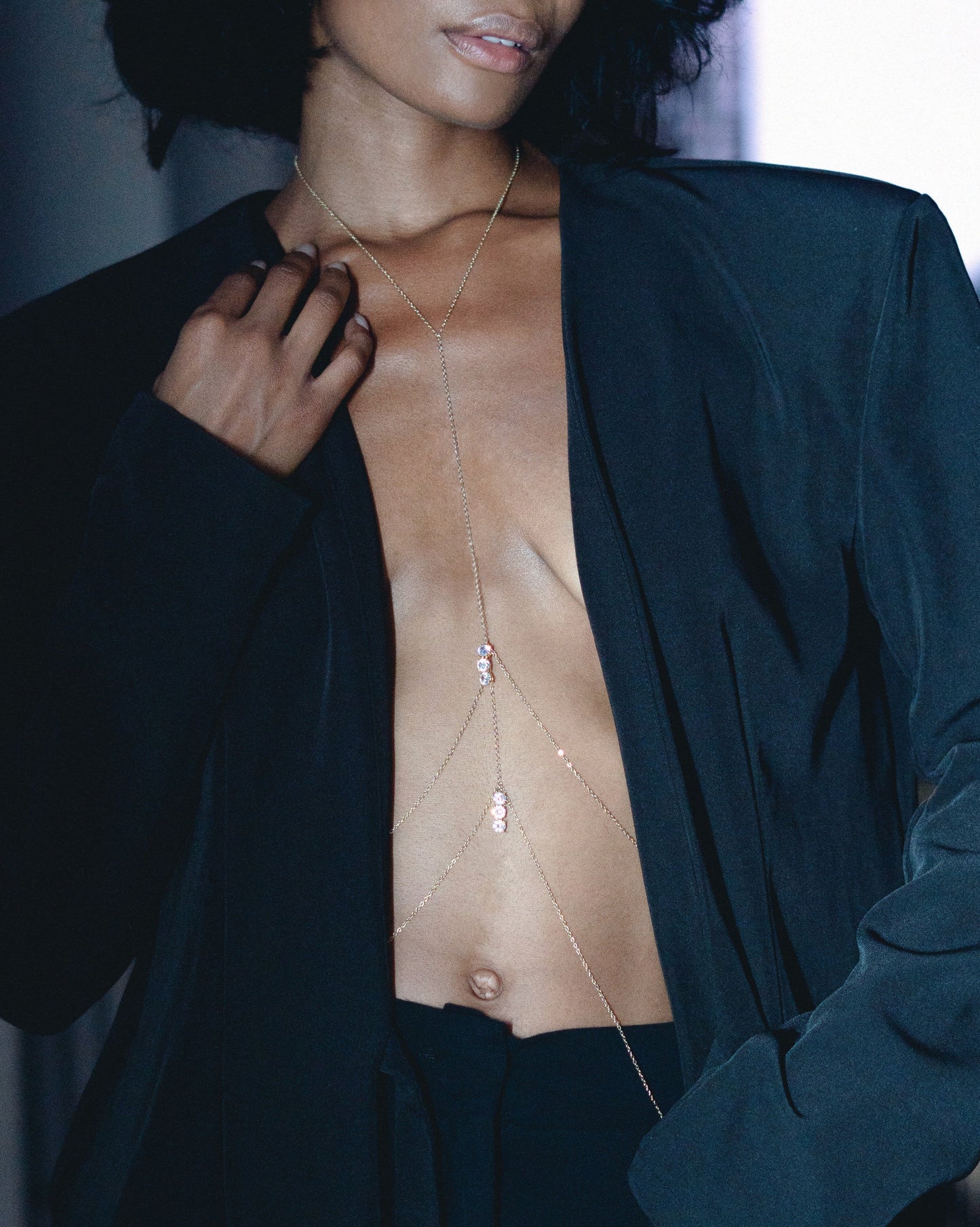 Body Chain on a woman wearing black outfit
