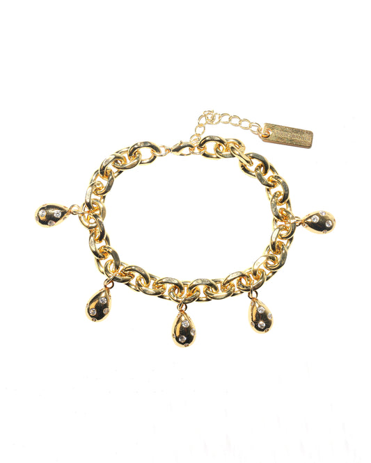 Gold chain bracelet with gold teardrop charms on a white background