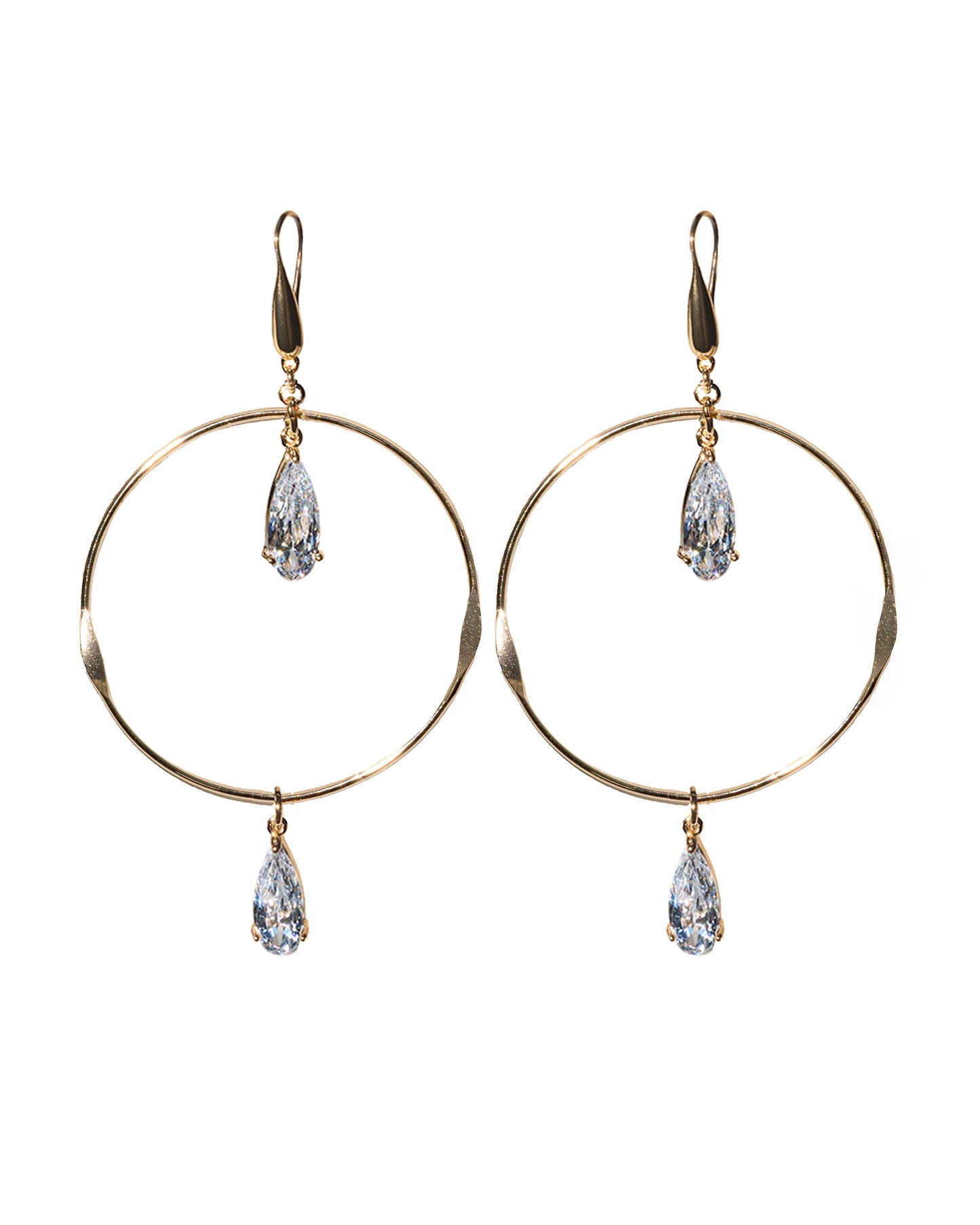 Gold hoop earrings with teardrop-shaped crystals on a white background
