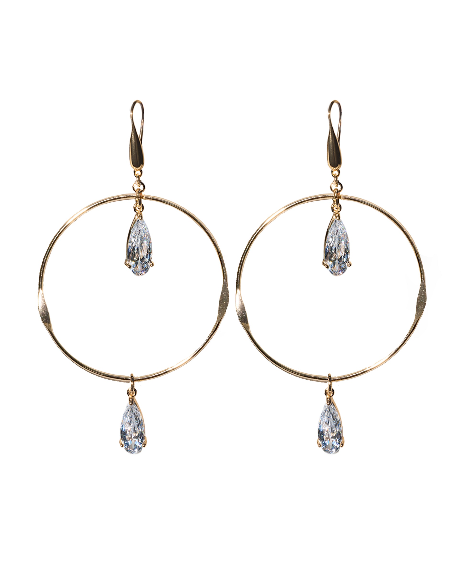 Gold hoop earrings with teardrop-shaped crystals on a white background
