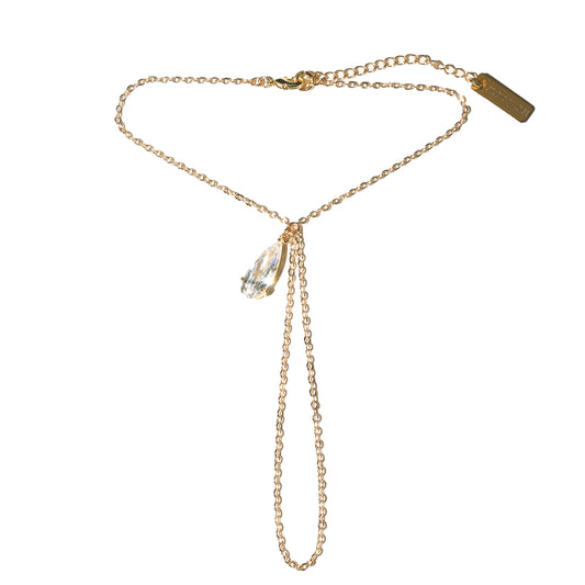 Gold chain necklace with a pendant on a white background