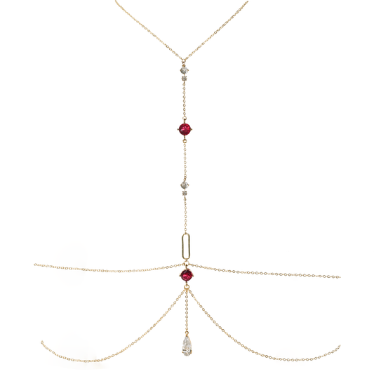 Gold necklace with red gemstones on a white background