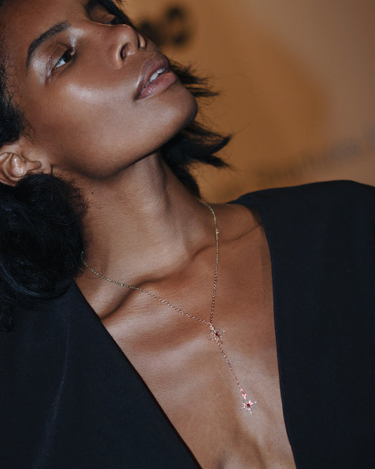 Woman wearing a delicate necklace with a blurred background