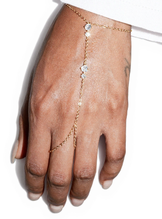 Sparkling Diamond on gold hand harness on white outfit 