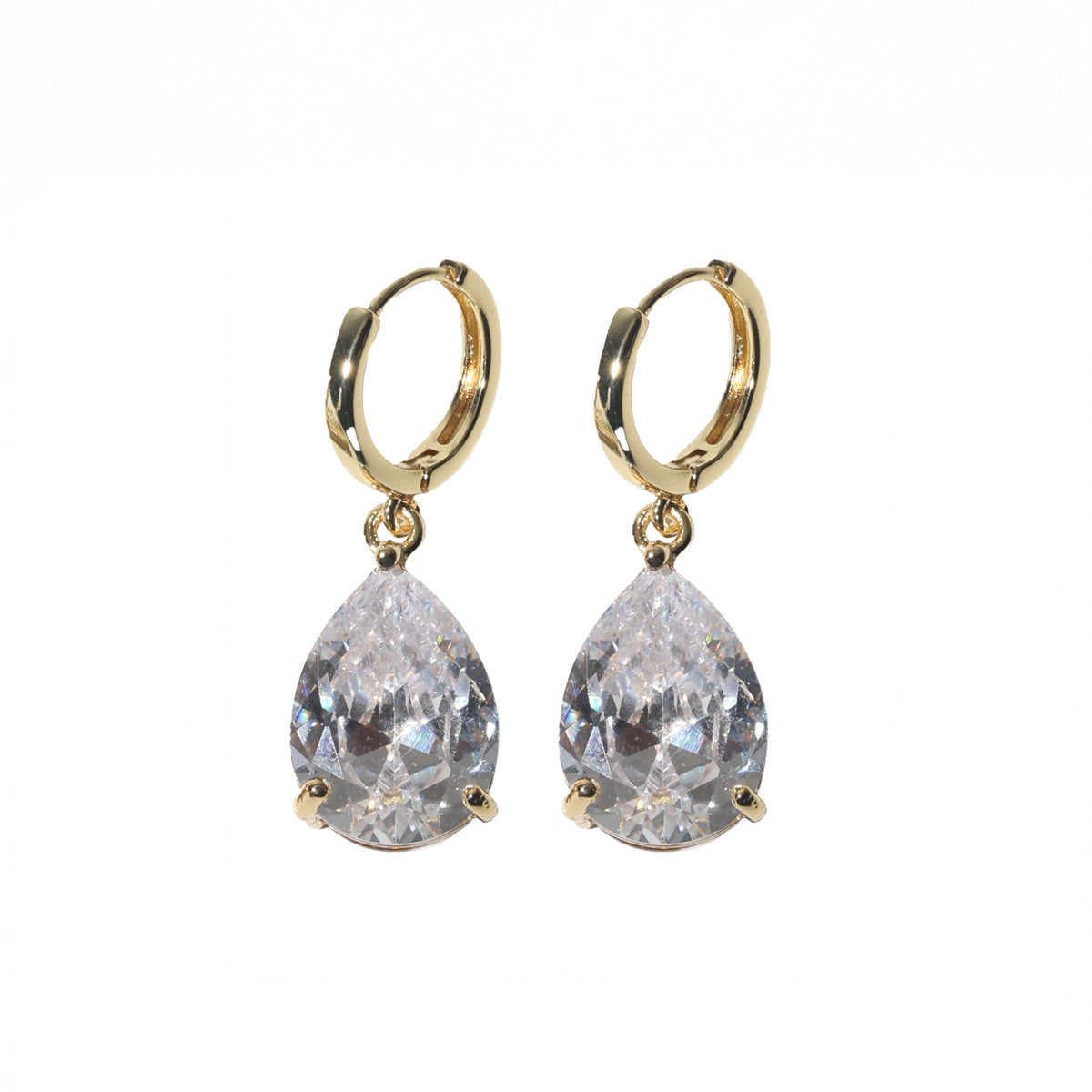 A pair of gold hoop earrings with teardrop-shaped clear gemstones, shown against a plain white background.
