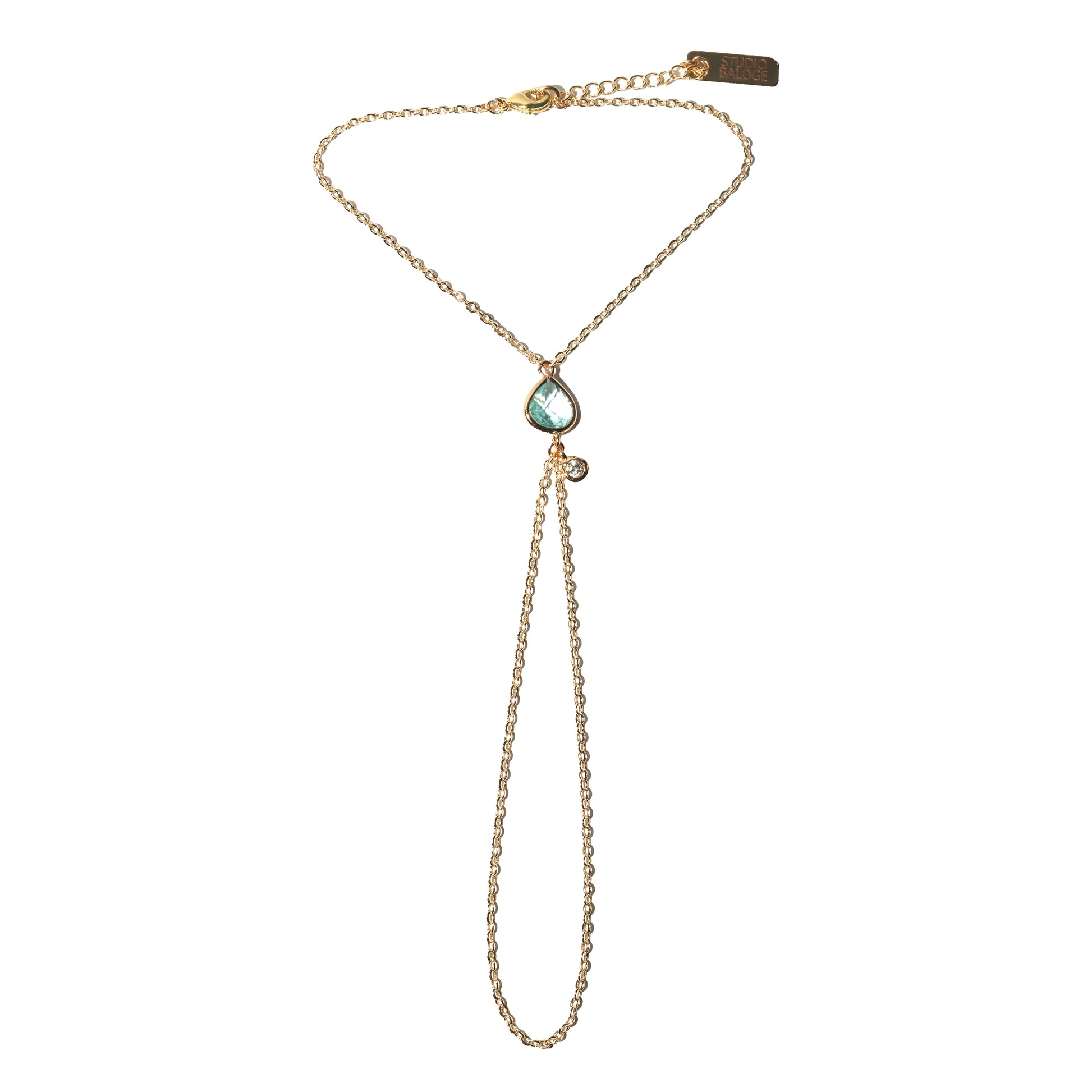 Point Hand Harness on white background featuring a single aquamarine gemstone drop