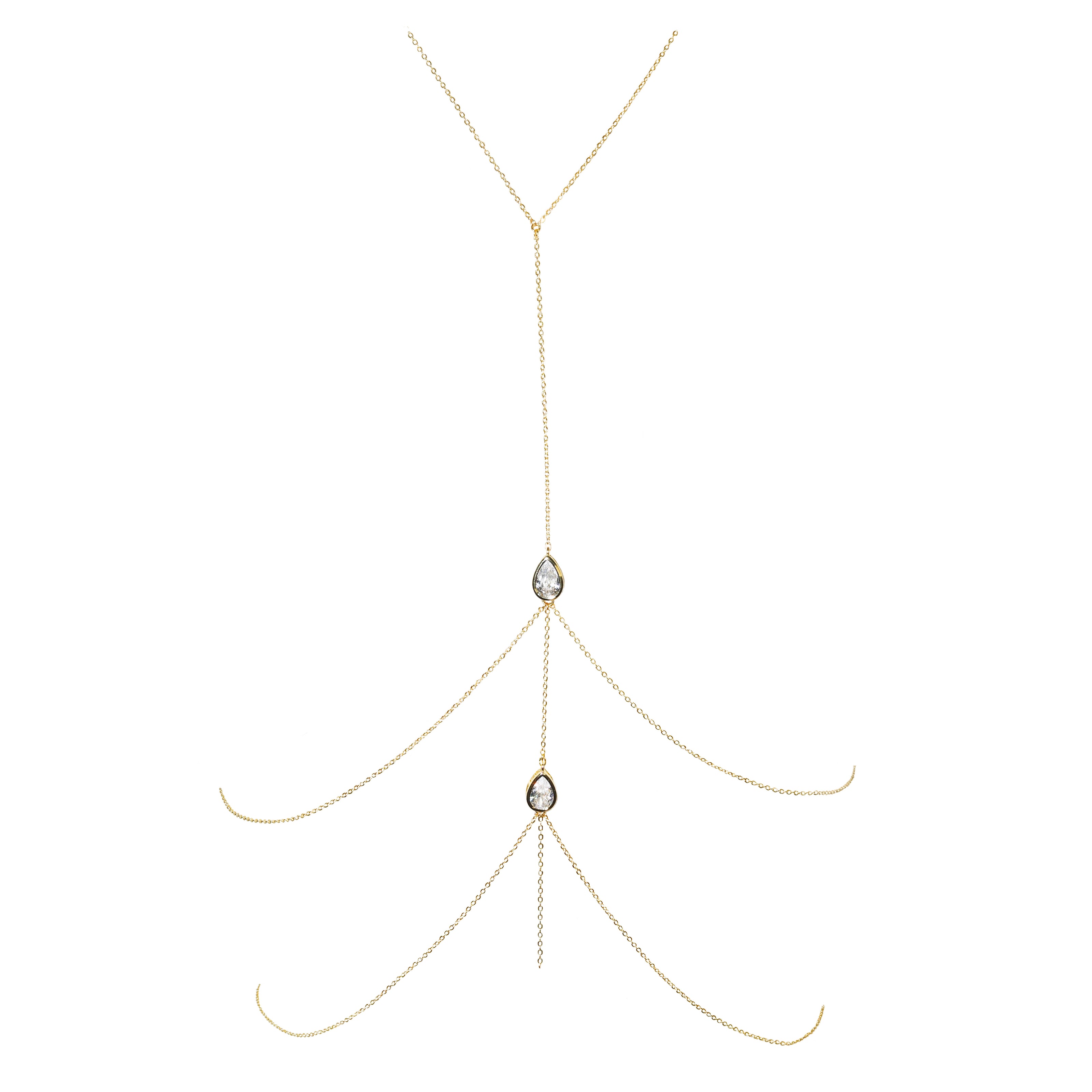 Gold body chain with two teardrop-shaped gemstones on a white background