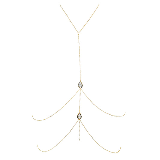 Gold body chain with two teardrop-shaped gemstones on a white background