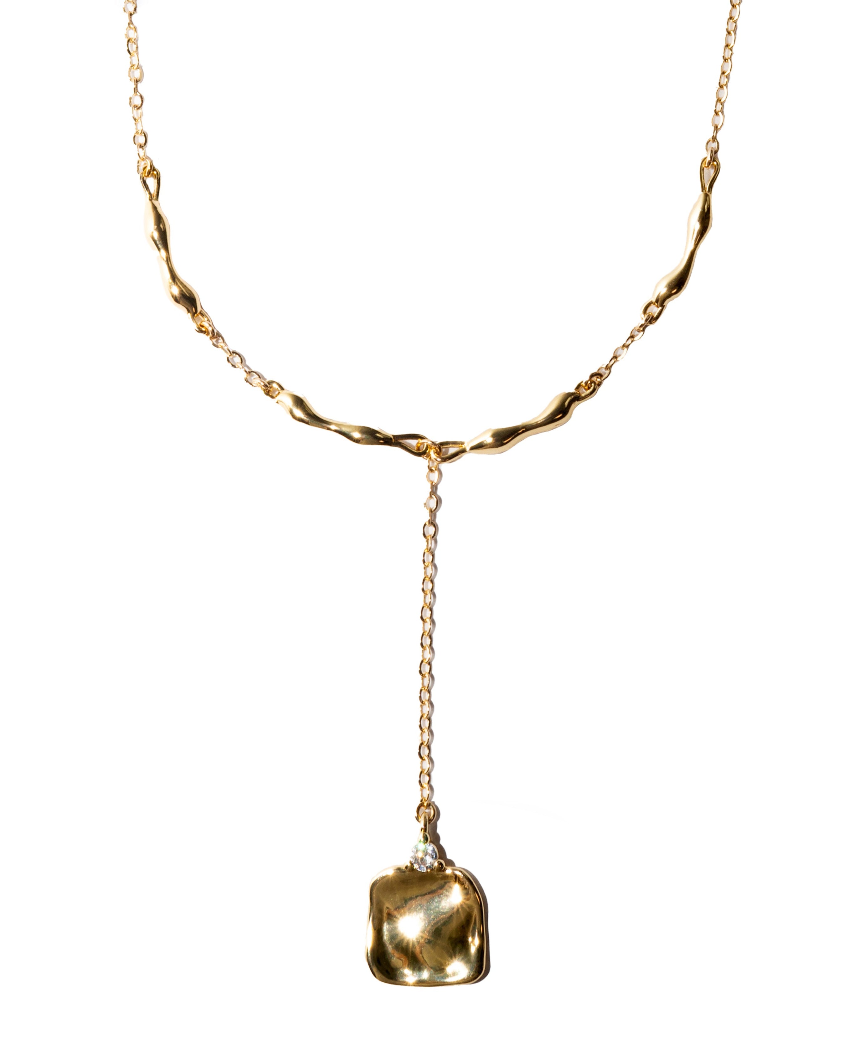 Gold necklace with a square pendant on a white background