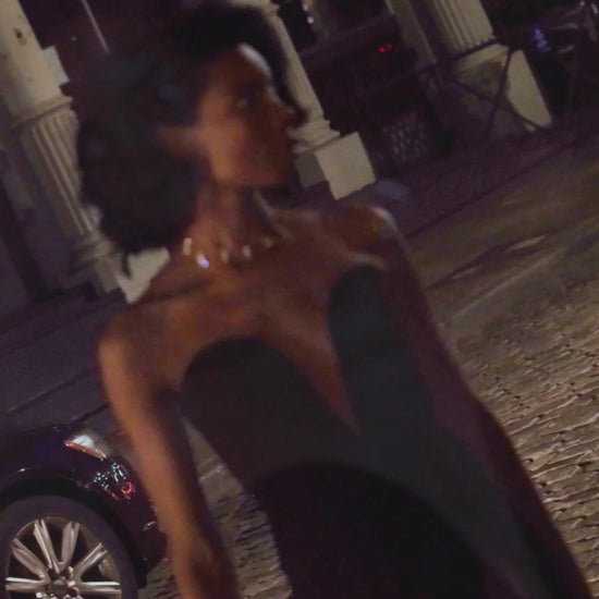 Elegant woman wearing black outfit and Studio Baloge delicate crystal choker necklace in the streets of Soho, New York