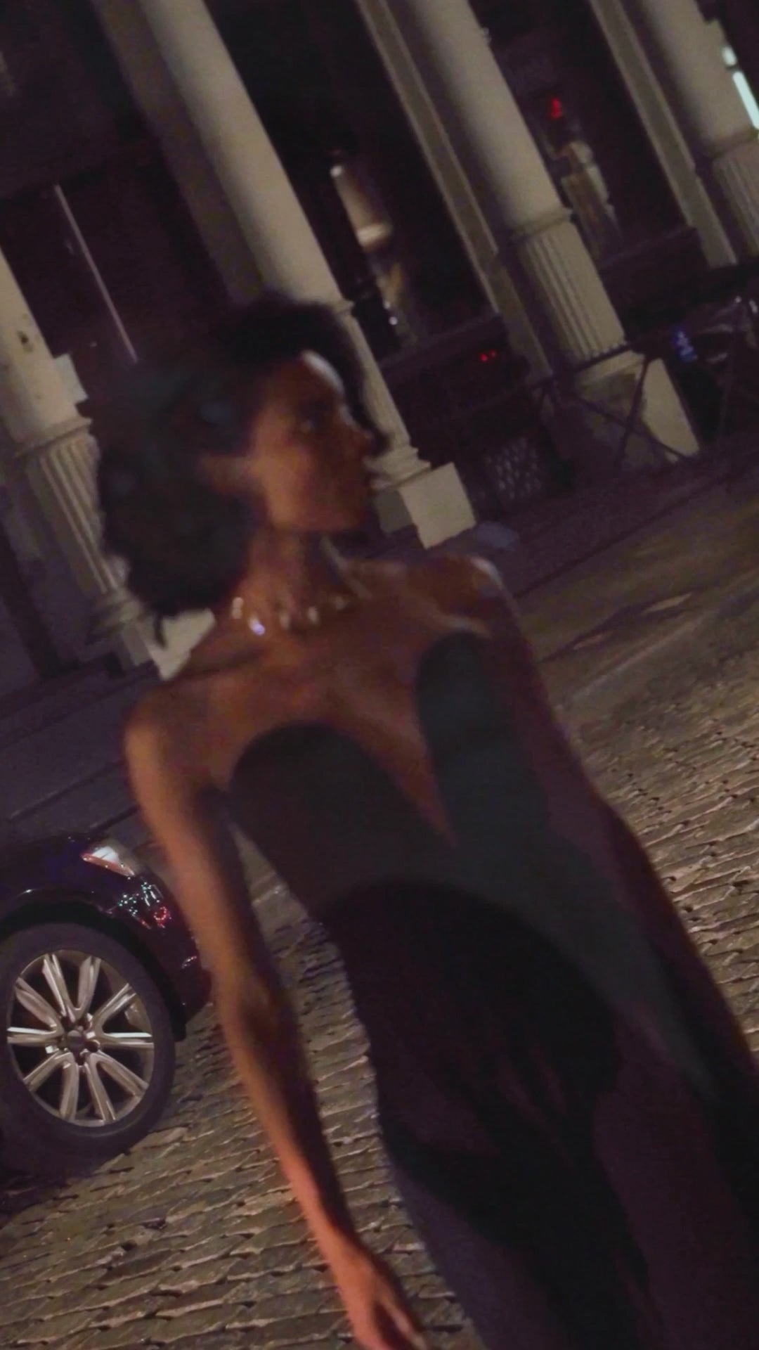 Elegant woman wearing black outfit and Studio Baloge delicate crystal choker necklace in the streets of Soho, New York